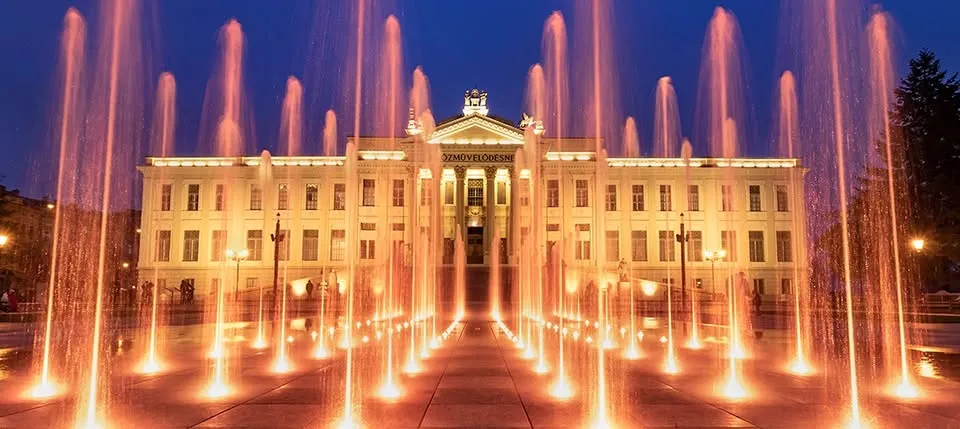 Szeged in evening lights . Sightseeing walk
